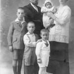 At four years old (centre) with brothers and parents.